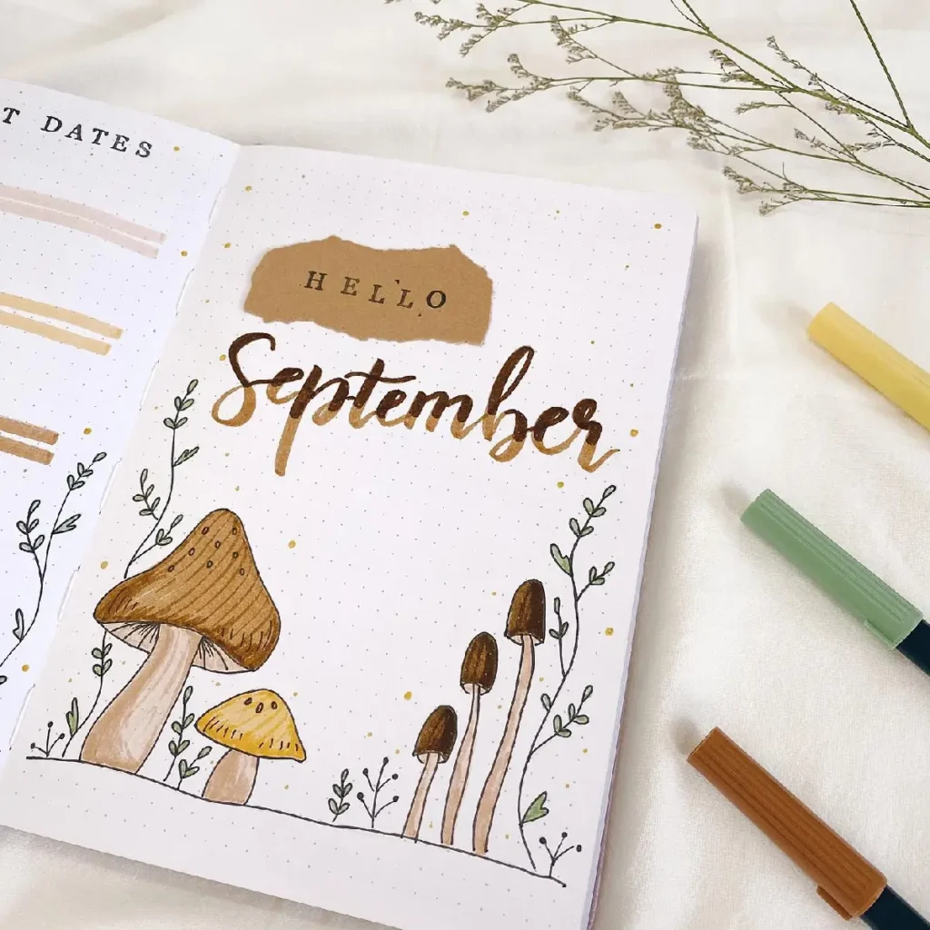 Colorful September bullet journal page featuring hand-drawn mushrooms and decorative elements for organization.