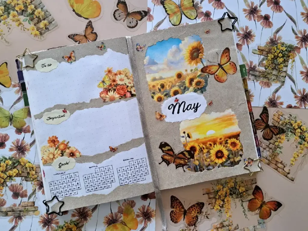 Colorful planner for May featuring sunflowers, butterflies, and decorative elements on a floral background. Perfect for organization.