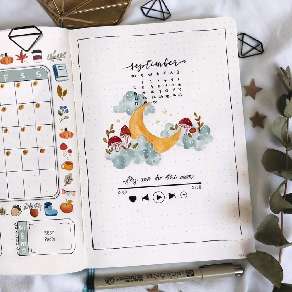September bullet journal layout featuring a calendar, moon illustration, and music playlist prompt with colorful accents.
