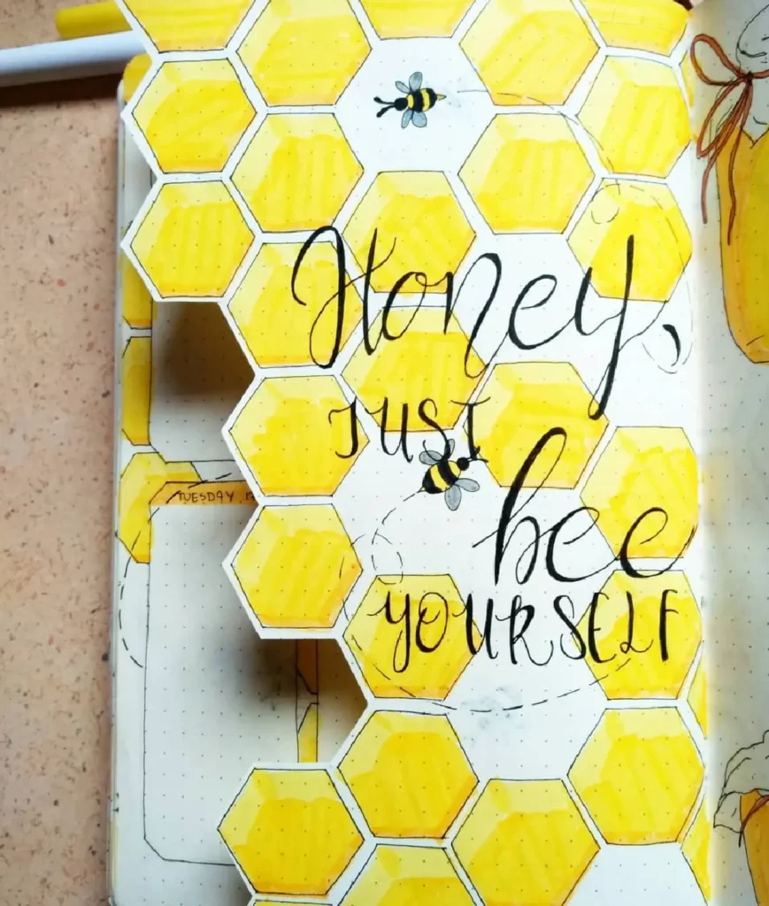 Hand-drawn bullet journal page featuring yellow honeycomb and the quote Honey, just bee yourself. Creative illustration.