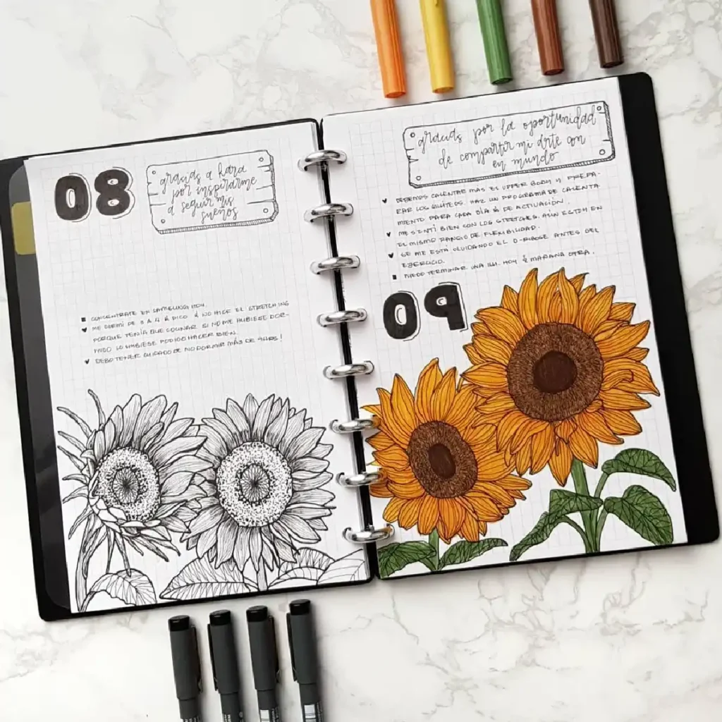 Colorful journal page featuring hand-drawn sunflowers, notes, and colorful pens on a marble background.