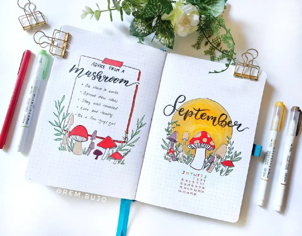 Colorful bullet journal spread for September featuring mushrooms and motivational quotes, surrounded by decorative plants.