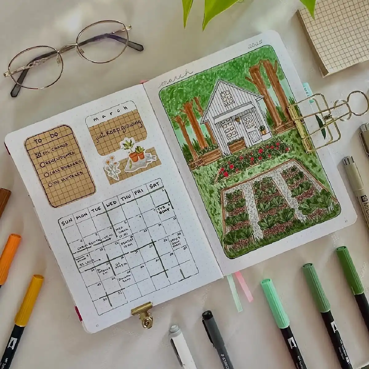 A bullet journal page for March 2025 featuring a garden illustration, to-do list, and weekly planner, with art supplies.