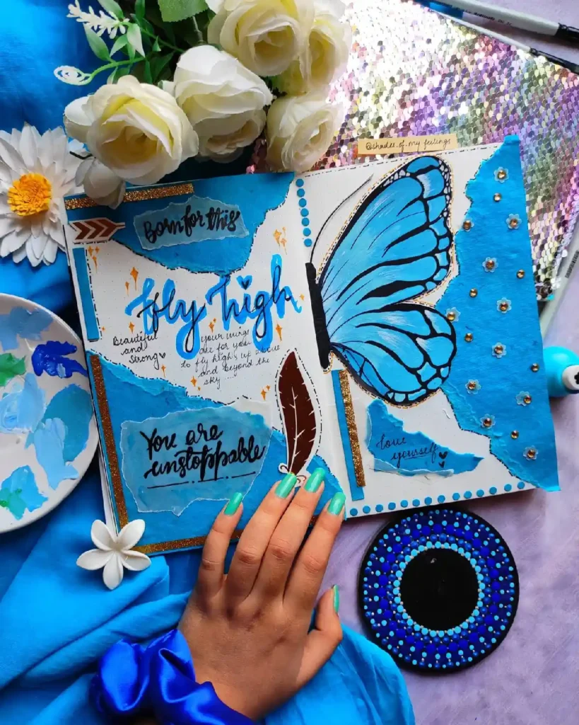 Creative journal page featuring a blue butterfly, inspirational quotes, and artistic decor on a vibrant background.