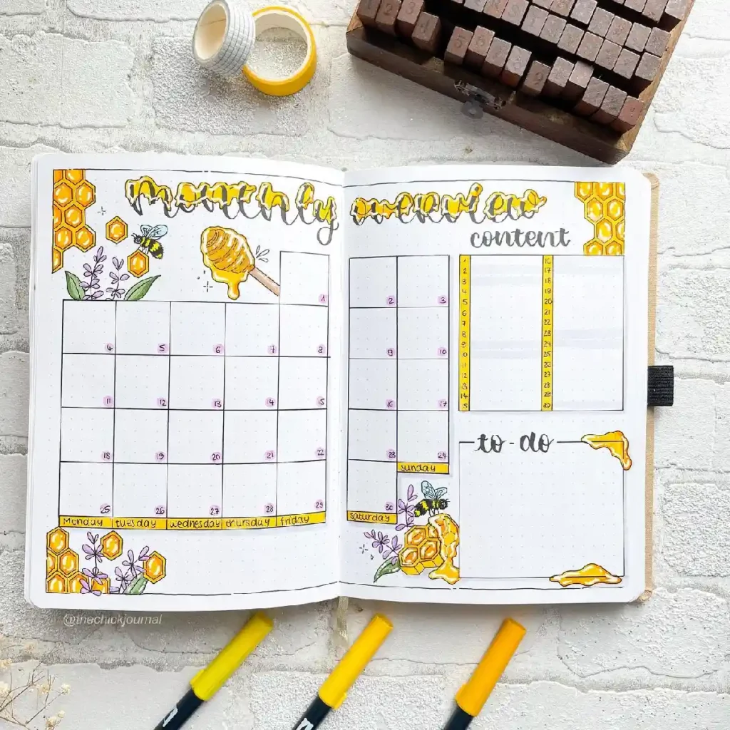 Colorful bullet journal spread featuring a monthly overview, to-do lists, and bee-inspired decorations.