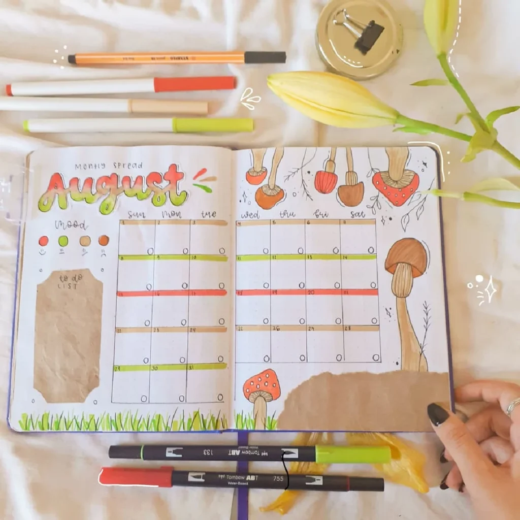 Colorful August monthly spread in a bullet journal featuring mushrooms, mood tracker, and to-do list layout.