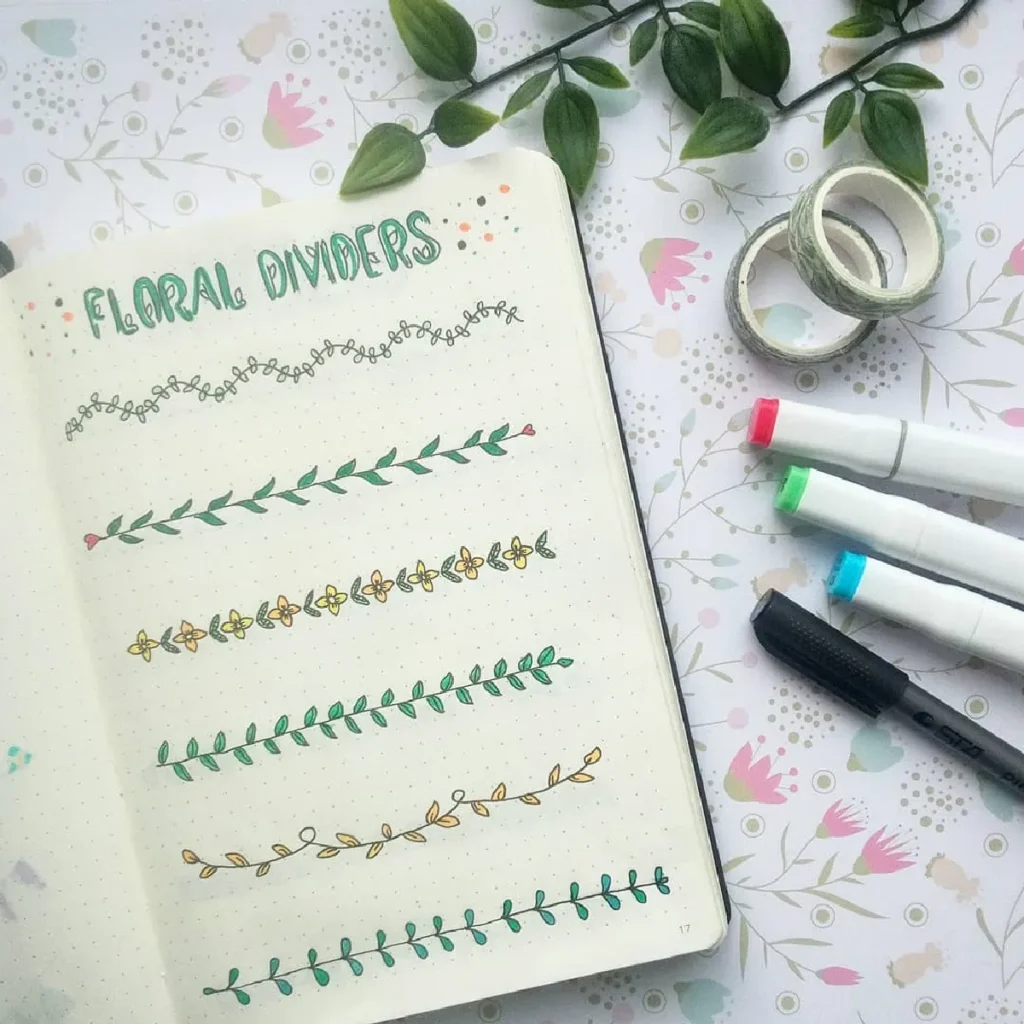 Bullet journal page featuring colorful floral dividers, washi tape, and markers on a patterned background.