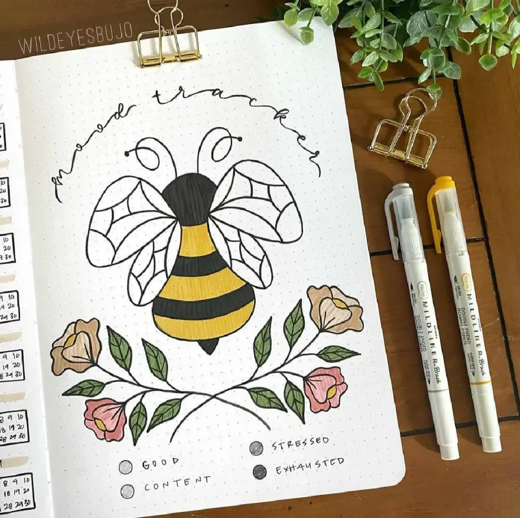 Colorful mood tracker featuring a bee and floral design on a bullet journal page, showcasing emotional states.